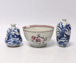 Two Chinese blue and white snuff bottles and a famille rose tea bowl, highest 7cm