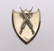 A late Victorian silver shield shaped letter clip, with crossed rifles clip, William Comyns?,