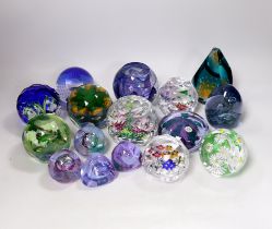 A collection of sixteen modern Caithness glass paperweights with boxes including some limited