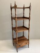 An early Victorian rosewood four tier whatnot