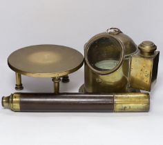 A ship’s brass binnacle containing a Sestrel compass and with a built in oil lamp, a bronze circular