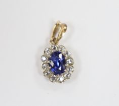 A yellow metal, synthetic sapphire and diamond set oval cluster pendant, overall 19mm, gross