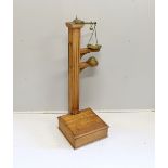 A Youngs of Bear St. London Victorian brass mounted oak personal weighing scales with incorporated