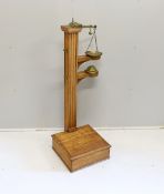 A Youngs of Bear St. London Victorian brass mounted oak personal weighing scales with incorporated