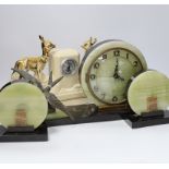 A French Art Deco green onyx clock garniture with bluebird spelter mount, together with two French