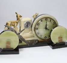 A French Art Deco green onyx clock garniture with bluebird spelter mount, together with two French