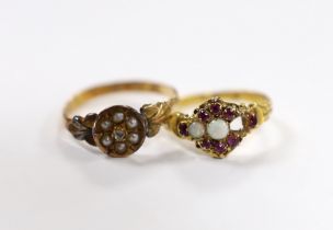 A Victorian 18ct gold, white opal and garnet cluster set dress ring, (opal missing), size J/K, gross