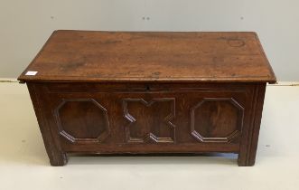 A small 17th century oak coffer with moulded geometric panelled front, width 108cm, depth 49cm,