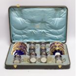 A set of eight Aynsley porcelain coffee cans and saucers, the cans with silver holders, William