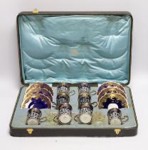 A set of eight Aynsley porcelain coffee cans and saucers, the cans with silver holders, William