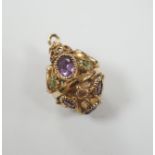 A modern 9ct gold, amethyst and peridot set pendant, or pierced spherical form, 25mm, gross weight