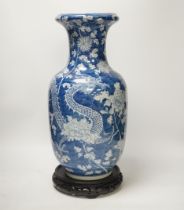 A Chinese blue and white baluster vase decorated with dragons and flowers together with an