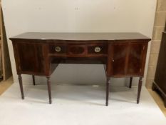 An Edwardian George III style Maple & Co banded mahogany serpentine sideboard, width 182cm, depth