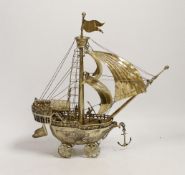 A late 19th/early 20th century Hanau silver gilt model of a Nef on four wheels, possibly by