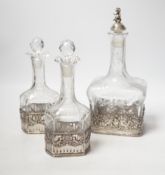 A George V Hanau silver mounted etched glass three piece decanter suite, import marks for Berthold