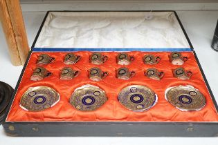 A Japanese Satsuma pottery set of 12 coffee cans and saucers, cased