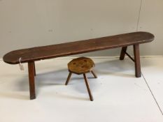 A 19th century pine and fruitwood bench and an elm hexagonal stool, bench length 172cm, height