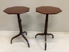 A pair of Regency style octagonal mahogany tripod wine tables, width 40cm, height 72cm