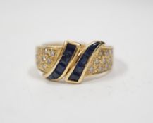 A modern 750 yellow metal, sapphire and diamond chip set dress ring, size K, gross weight 4.8