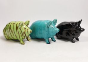 Three Wemyss style pigs in turquoise, pale green / brown and black glazes, one indistinctly marked