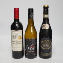 Thirteen bottles of mixed red and white wines, including a bottle of Chateau Beausejour Saint-