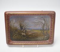 A late 19th century French painted faience plaque of storks in a landscape, 18 x 25cm