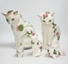 A Plichta clover pattern cat, a Plichta thistle pattern cat, together with two small Plichta cats