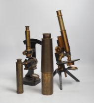 Two brass and black lacquered microscopes, one by Adam Hilger and two brass telescopes