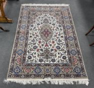 A Kashan ivory ground floral rug, 220 x 150cm