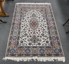 A Kashan ivory ground floral rug, 220 x 150cm
