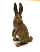 An Austrian cold painted bronze model of a hare, stamped Geschutz, 9cms high