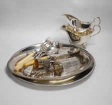 A small quantity of silver plate, two sauce boats, spirit labels, circular tray, etc.