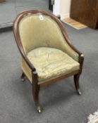 A 19th century Gillows style mahogany armchair on sabre legs width 54cm, depth 64cm, height 76cm.