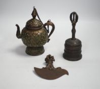 A Tibetan repousse teapot, a ghanta bell and a kartika chopper, tallest 19cm