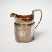 A George III silver cream jug, marks rubbed, 10.3cm.