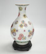 A Chinese famille rose vase, on hardwood stand, overall 27cm high