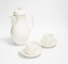 An early 20th century Berlin white glazed porcelain coffee set, tallest 21cm