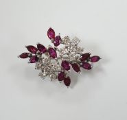 A modern white metal, ruby and diamond cluster set foliate spray pendant brooch, 32mm, gross