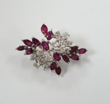 A modern white metal, ruby and diamond cluster set foliate spray pendant brooch, 32mm, gross