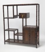 An early 20th century Chinese hongmu display shelf with cupboard and drawer, 46cm high