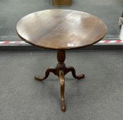 A George III circular mahogany tilt top tripod tea table, width 76cm, height 72cm
