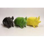 Three Wemyss ware pigs in green, yellow and black glazes, 15cm