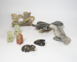 A group of Chinese soapstone and bowenite animal figures and a figural seal, largest 25cm wide (8)