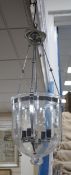 A pair of chrome plated and glass hanging lanterns