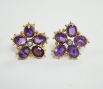 A pair of yellow metal, amethyst and seed pearl set flowerhead ear studs, 18mm, gross weight 4