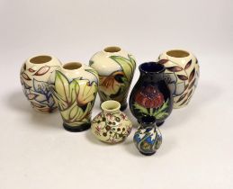Seven small Moorcroft vases, various patterns. Tallest 10cm