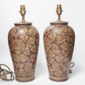 A pair of modern pottery floral designed lamps, total height 42cm