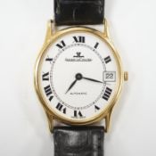 A gentleman's 18k Jaeger LeCoultre automatic dress wrist watch, with oval Roman dial and date