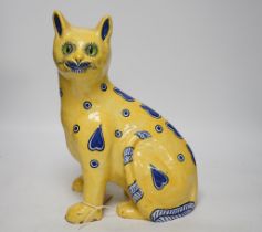 A Mosanic Galle style faience seated cat with glass eyes, c.1900-10, 31cm