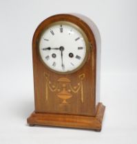 An Edwardian marquetry mantel clock with enamel dial, the case inlaid with swags, 26cm high